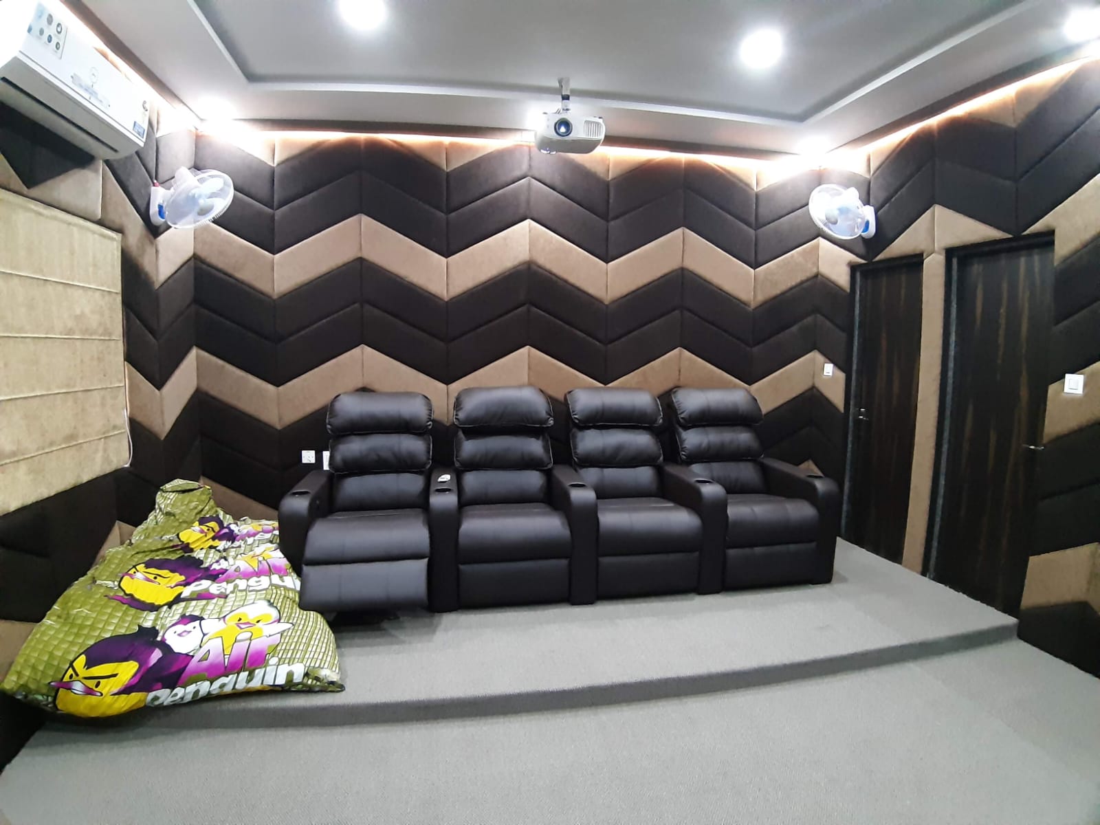 Home cinema recliner seating and acoustic treatment