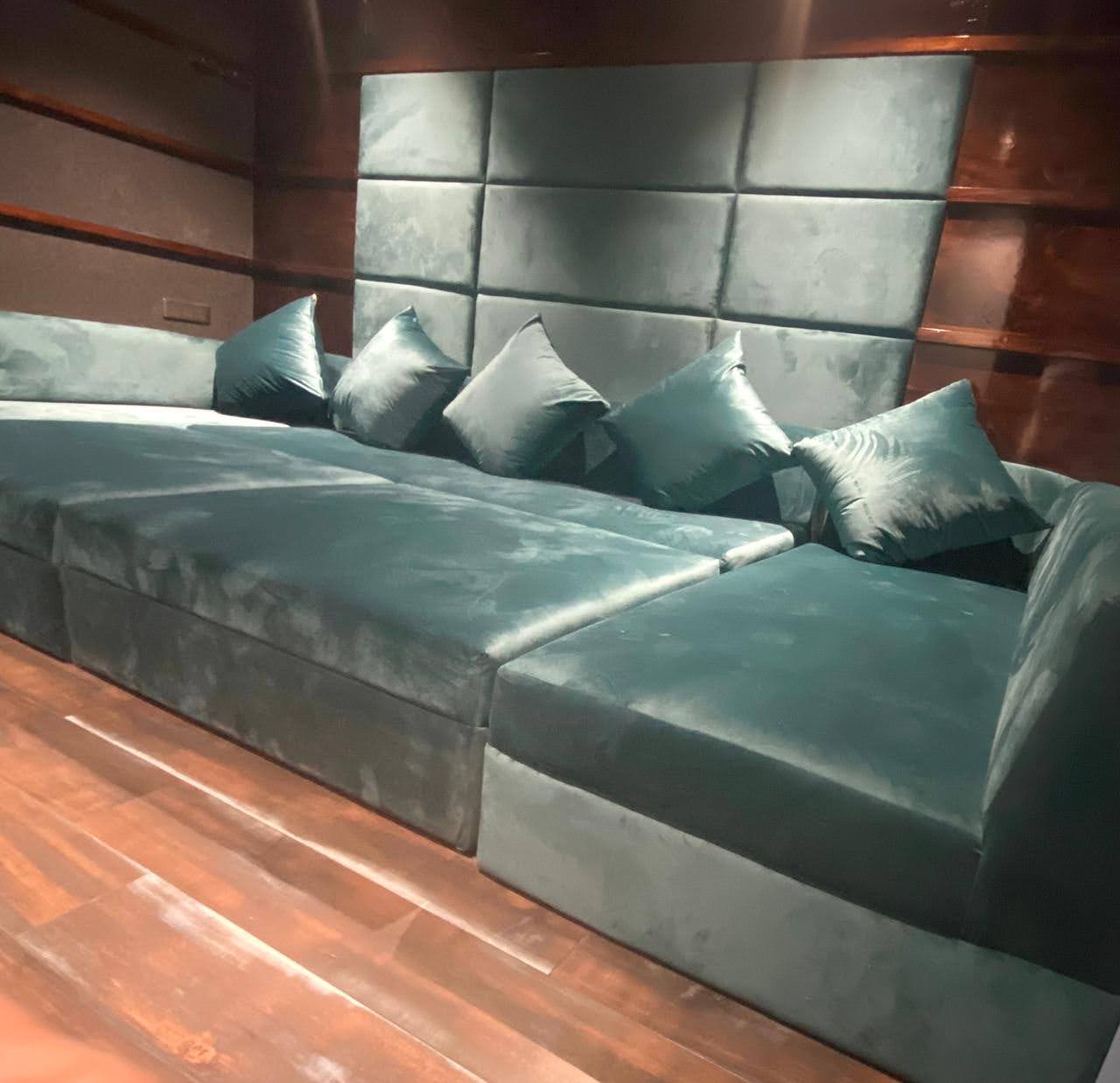 Custom green daybed seating for a cinema room