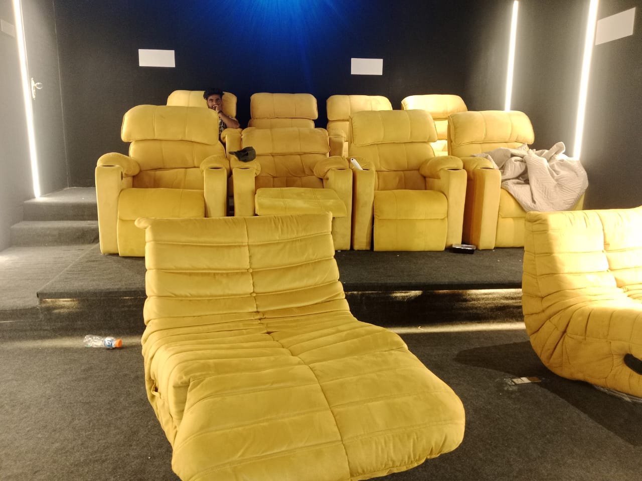 Tiered yellow home cinema recliner seating